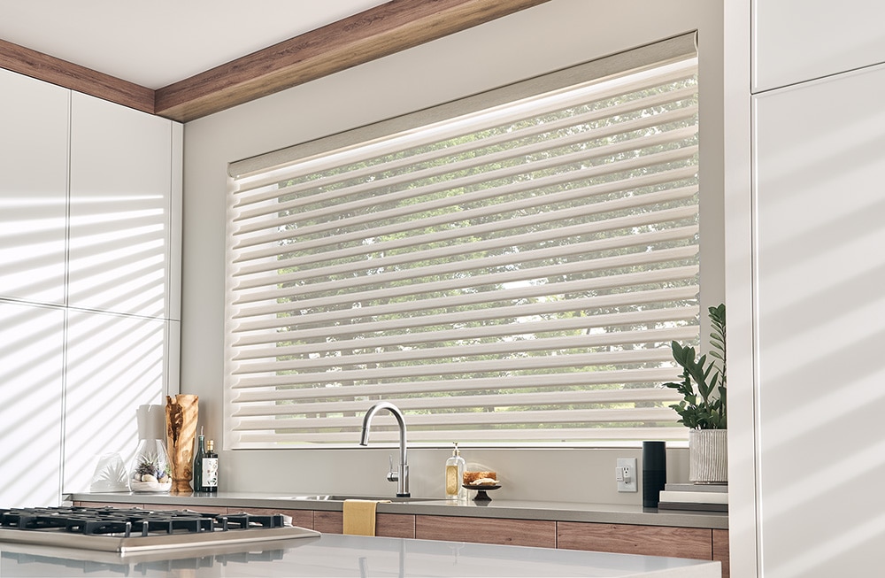 Custom made Sheer Shades filtering in light into a modern farmhouse looking kitchen.